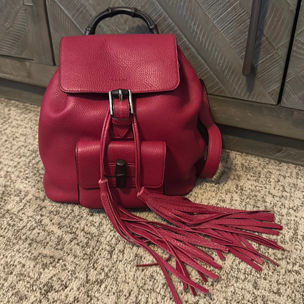 GUCCI pink/reddish backpack barely worn. excellent condition!